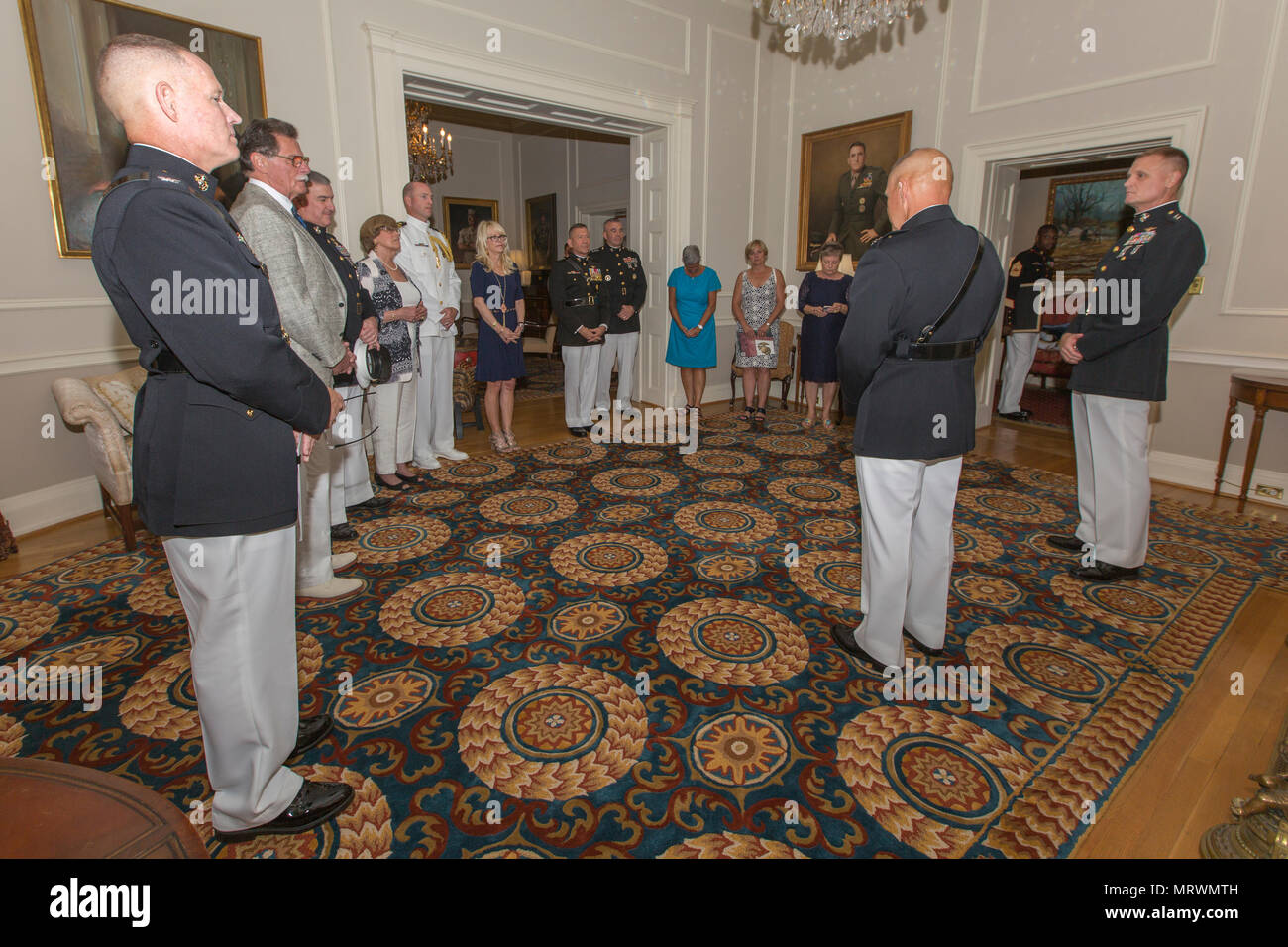 Commandant of the Marine Corps Gen. Robert B. Neller, center, speaks to ...
