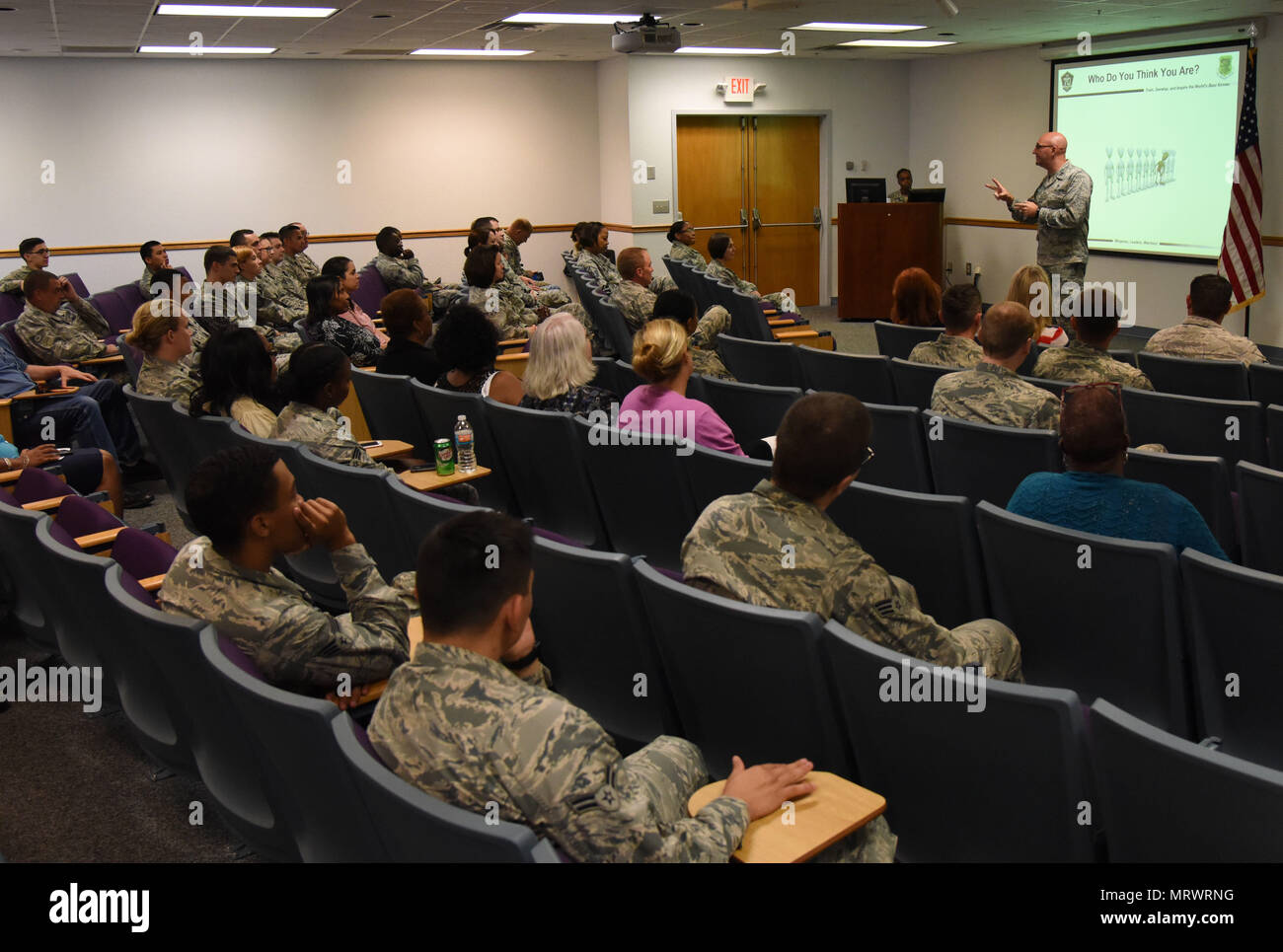 Capt. Adam Dell, 81st Medical Operations Squadron mental health flight commander, provides a suicide prevention briefing to members of the 81st Training Wing staff agency at the Sablich Center June 12, 2017, on Keesler Air Force Base, Miss. The briefing was one of several Wingman Week events focusing on resiliency and teambuilding initiatives across the base. (U.S. Air Force photo by Kemberly Groue) Stock Photo