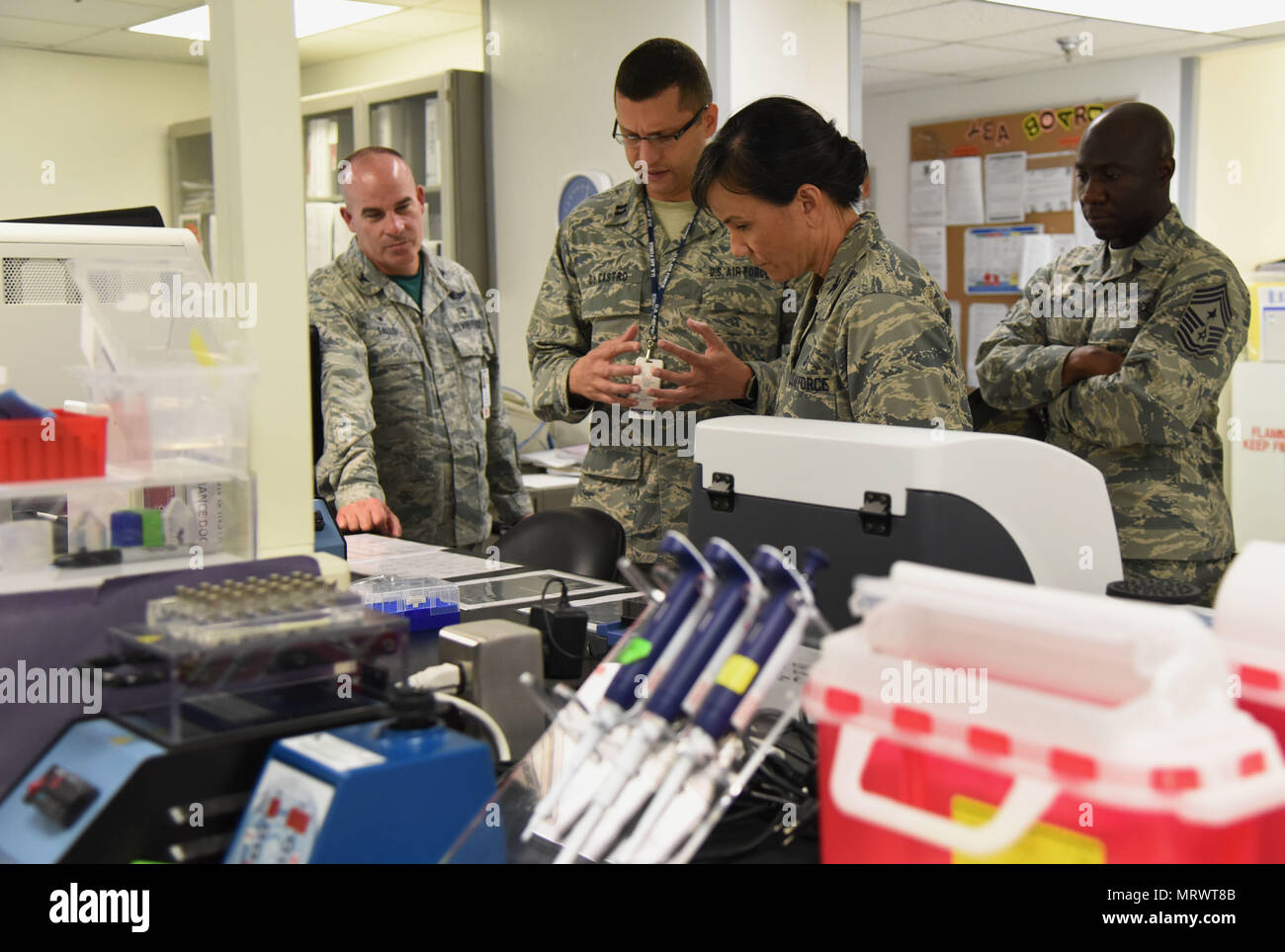 Capt. Mauricio De Castro Pretelt, 81st Medical Operations Squadron clinical and molecular geneticist, briefs Col. Debra Lovette, 81st Training Wing commander, on genetics laboratory capabilities and procedures during an 81st Medical Group orientation tour in the Keesler Medical Center June 16, 2017, on Keesler Air Force Base, Miss. The purpose of the tour was to familiarize Lovette with the group’s mission, operations and personnel. (U.S. Air Force photo by Kemberly Groue) Stock Photo