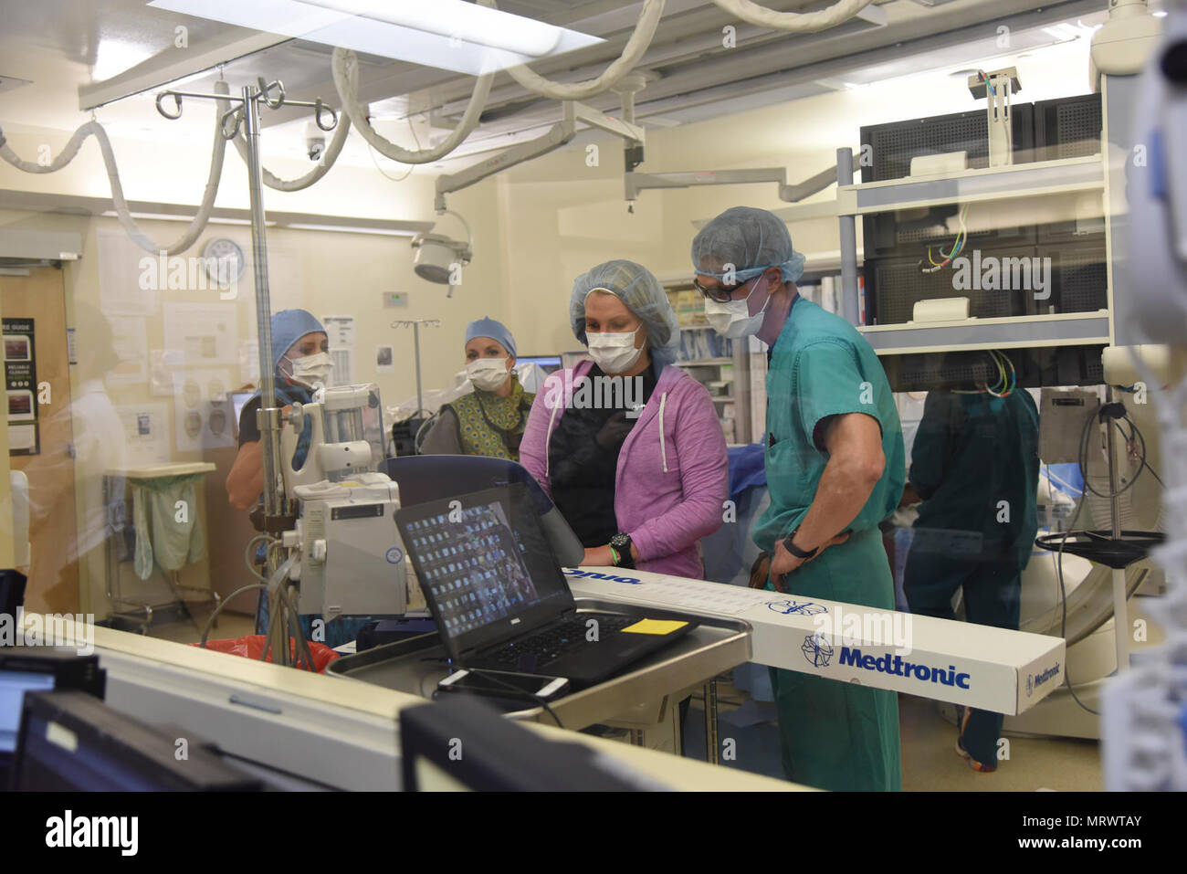 Members of the 81st Medical Operations Squadron prepare to insert a Micra Transcatheter Pacing System at the Keesler Medical Center April 13, 2017, on Keesler Air Force Base, Miss. The Micra Transcatheter Pacing System is a new type of heart device that provides patients with the most advanced pacing technology at one-tenth the size of a traditional pacemaker. Keesler is the first Air Force hospital to offer the world’s smallest pacemaker for patients with bradycardia. Stock Photo