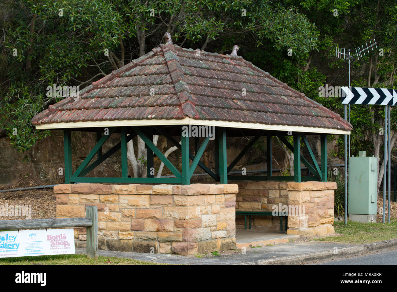 The Bobbin Head bus stop built in the depression era of the 1930's from sandstone, timber and marseille terracotta tile hip roof. Stock Photo