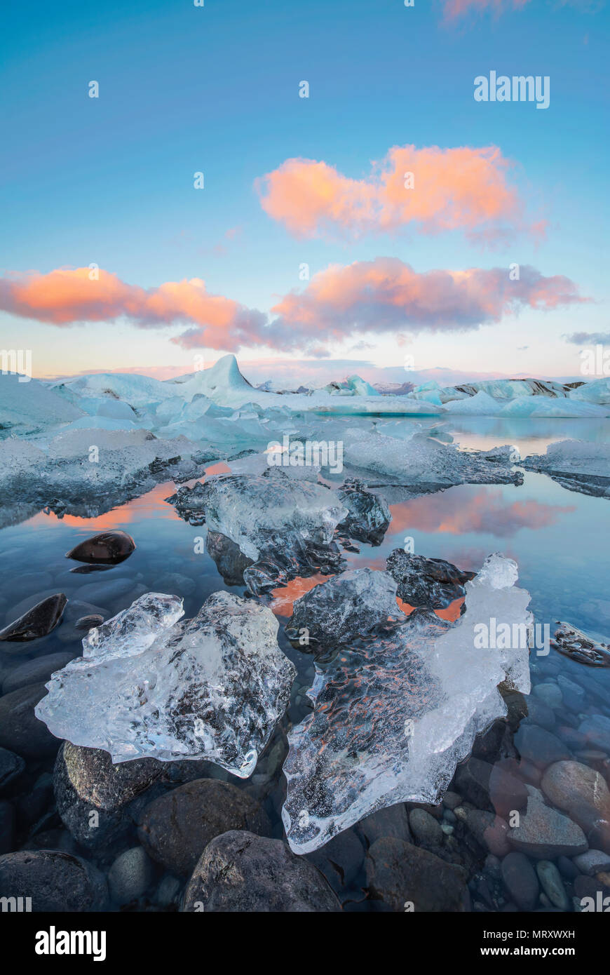 Jokulsarlon, Eastern Iceland, Iceland, Northern Europe. The iconic little icebergs lined in the glacier lagoon during a sunrise Stock Photo