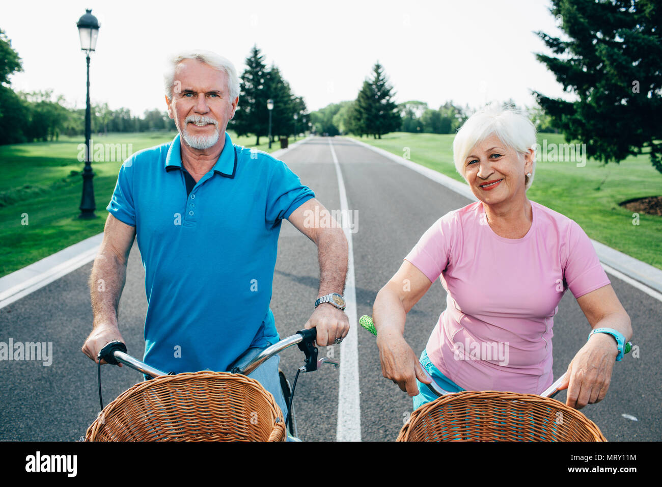 senior couple going for a bicycle ride in the park Stock Photo