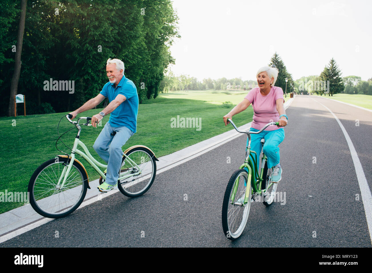 Older Caucasian couple riding bicycle Stock Photo