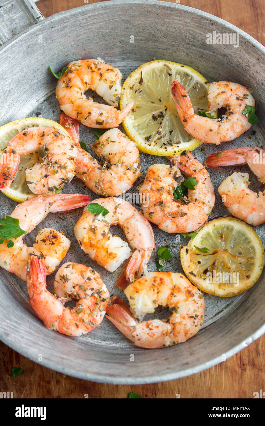 Roasted Shrimps With Lemon Garlic And Herbs Seafood Shelfish Shrimps Prawns Grilled With Spices Garlic And Lemon On Black Stone Background Copy Stock Photo Alamy