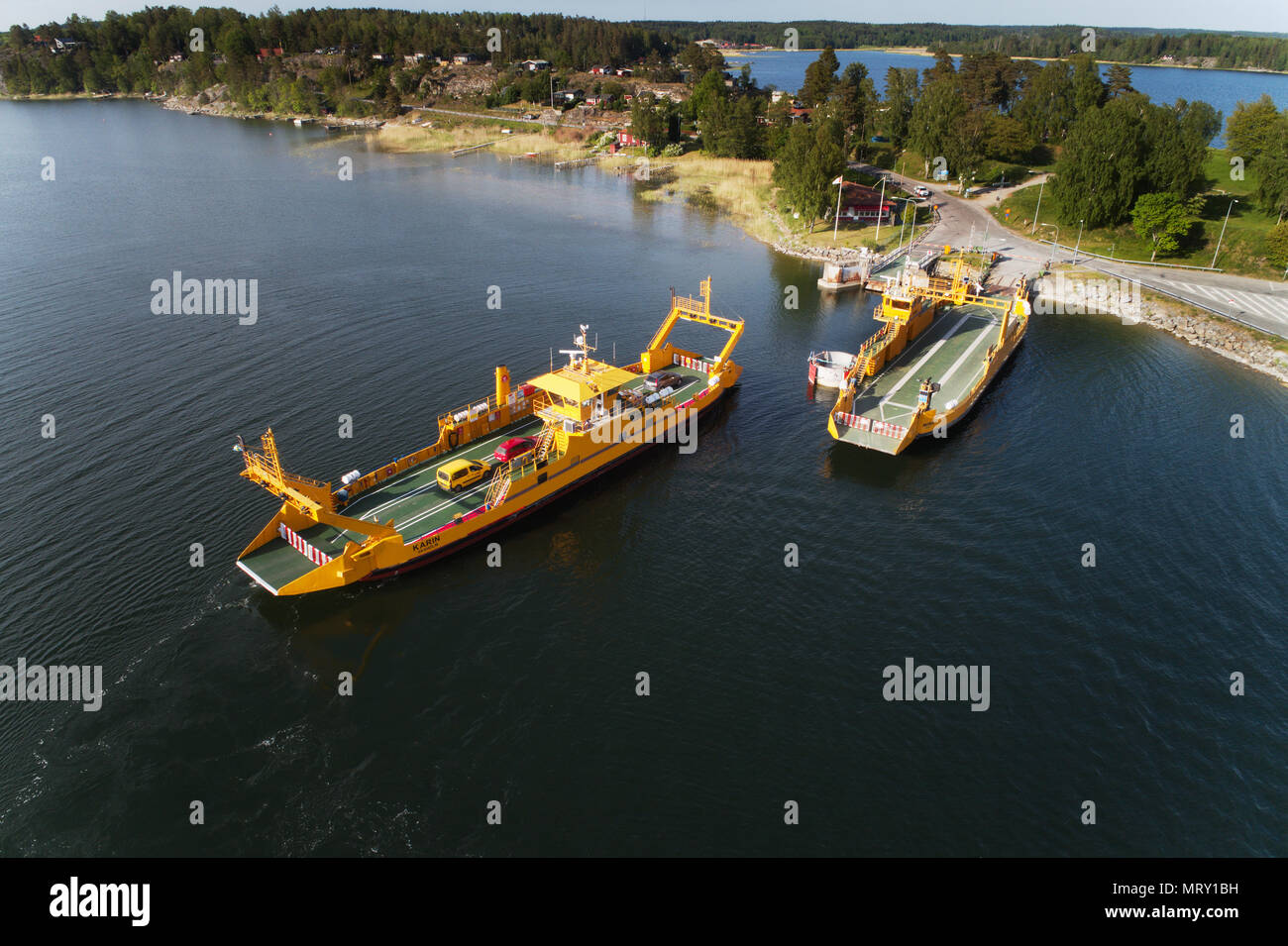 Horningsnas, Sweden - May 22, 2018: Aerial view of a yellow road ferry operateded by the Swedish Transport Administration (Trafikverket)  as part of t Stock Photo