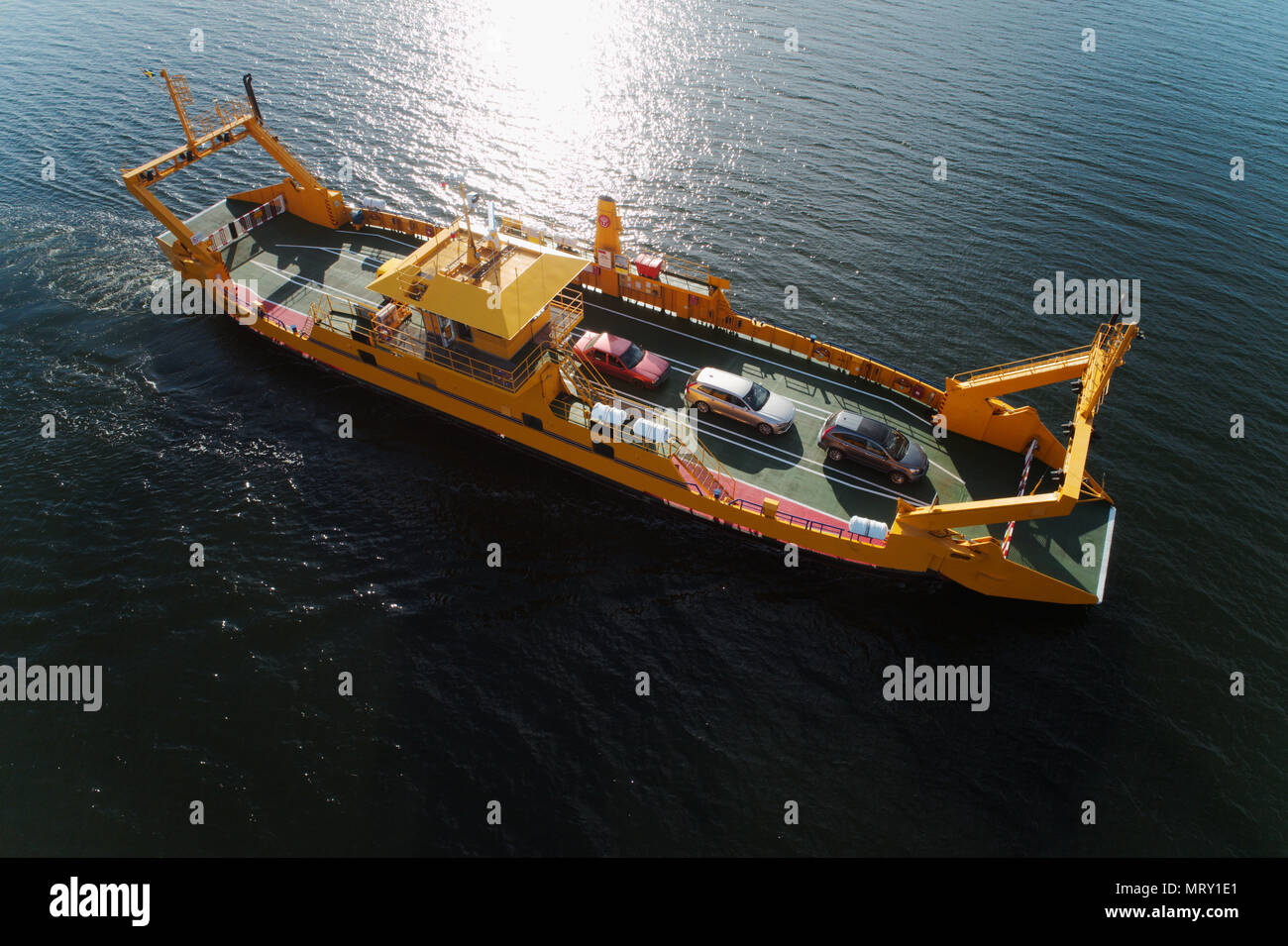 Horningsnas, Sweden - May 22, 2018: Aerial view of a yellow road ferry operateded by the Swedish Transport Administration (Trafikverket)  as part of t Stock Photo