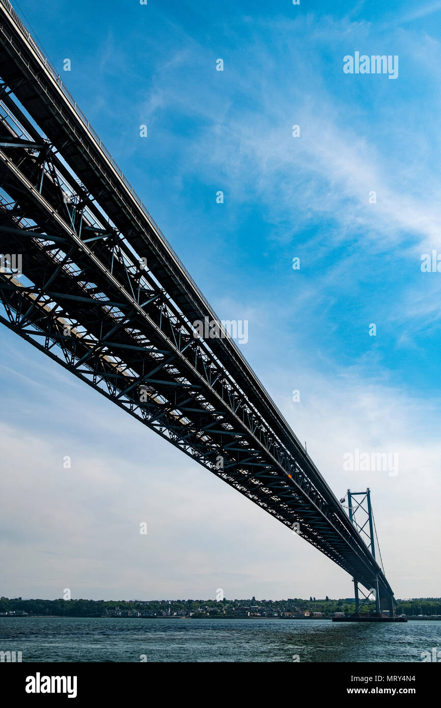 View of Forth Road bridge from below crossing the Firth of Forth in Scotland, UK Stock Photo