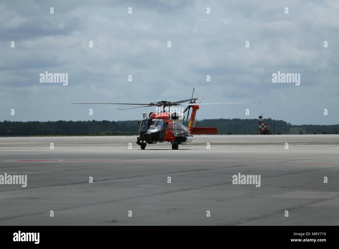 A U.S. Coast Guard MH-60T Jayhawk taxis down the flight line at Marine Corps Air Station Cherry Point, N.C. after the Fifth District Search and Rescue Exercise (SAREX) on July 11, 2017. SAREX was a joint exercise conducted to certify the U.S. Coast Guard's capability to rescue Marine Corps pilots in the event of a downed aircraft. (U.S. Marine Corps photo by Lance Cpl. Jailine L. Martinez) Stock Photo