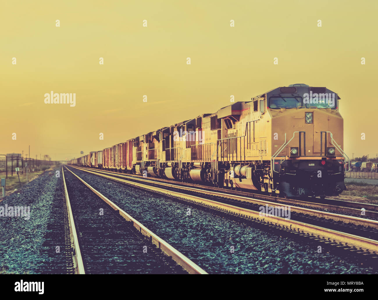 Freight train traveling through desert Arizona Stock Photo Alamy