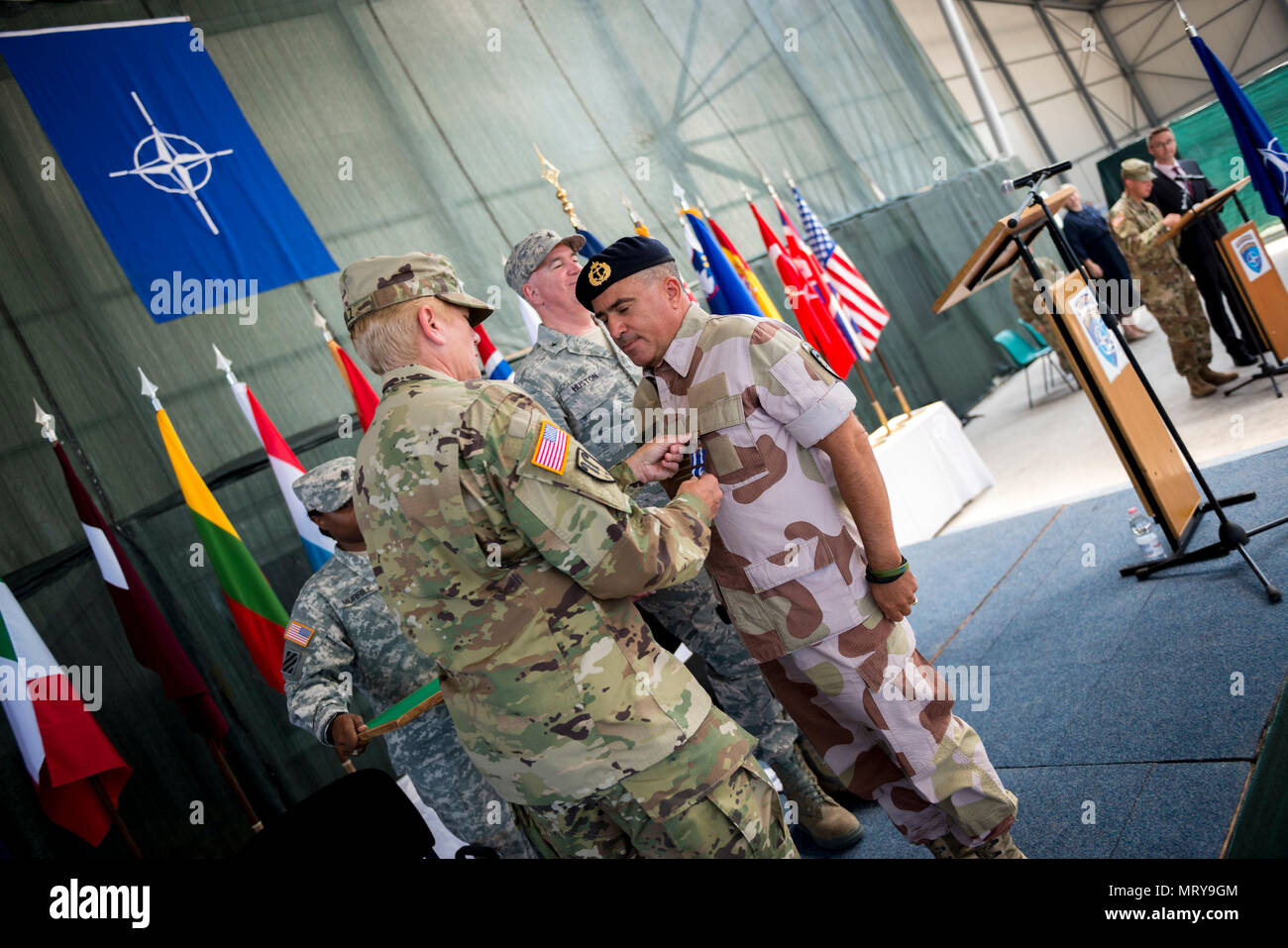 U.S. Army Brig. Gen. Giselle Wilz transfers authority of NATO Headquarters Sarajevo to U.S. Air Force Brig. Gen. Robert Huston during a ceremony held on June 27th, 2017 at Camp Butmir, Bosnia and Herzegovina. (U.S. Air Force photo by Tech. Sgt. Jeremy Bowcock) Stock Photo
