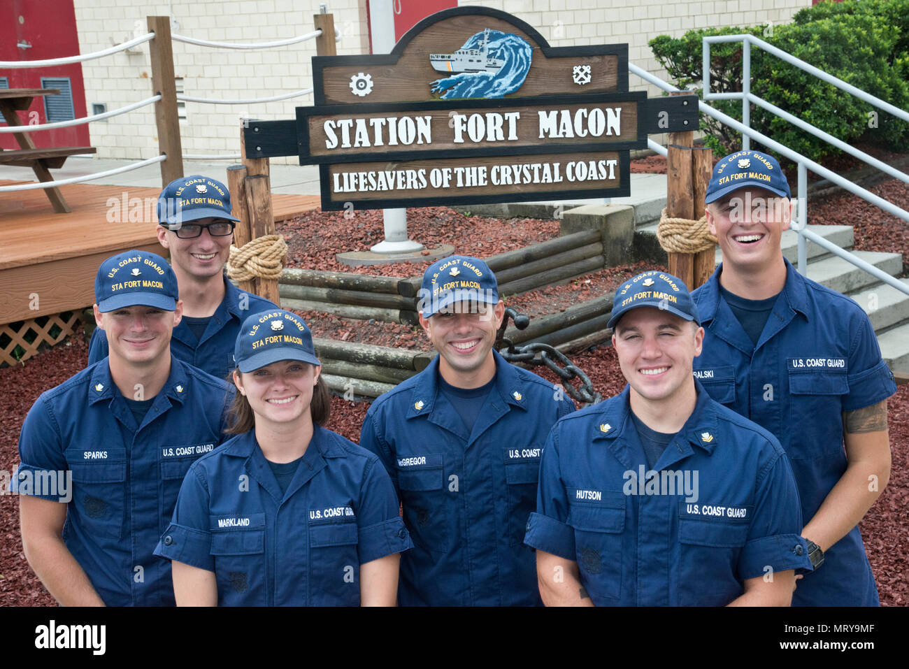 Petty Officer 3rd Class Michael Sparks (left to right), Fireman Samuel Ragsdale, Fireman Jordan Markland, Petty Officer 2nd Class Tyler McGregor, Petty Officer 2nd Class Zane Hutson and Seaman Crewe Goralski reunite at Station Fort Macon, North Carolina, July 10, 2017. Sparks and Ragsdale were rescued by the others July 6 after a diving incident where the two were stranded eight miles off Atlantic Beach. (U.S. Coast Guard photo by Petty Officer 2nd Class Nate Littlejohn) Stock Photo