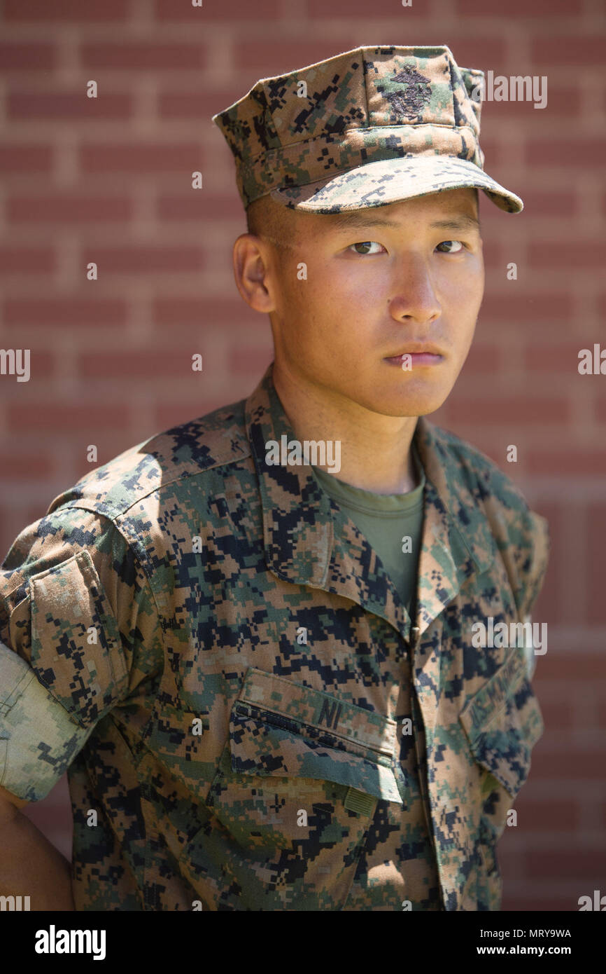 Pvt. Zetian Ni, Platoon 2054, Hotel Company, 2nd Recruit Training Battalion, earned U.S. citizenship July 13, 2017, on Parris Island, S.C. Before earning citizenship, applicants must demonstrate knowledge of the English language and American government, show good moral character and take the Oath of Allegiance to the U.S. Constitution. Ni, from Pittsburgh, originally from China, is scheduled to graduate July 14, 2017. (Photo by Lance Cpl. Maximiliano Bavastro) Stock Photo