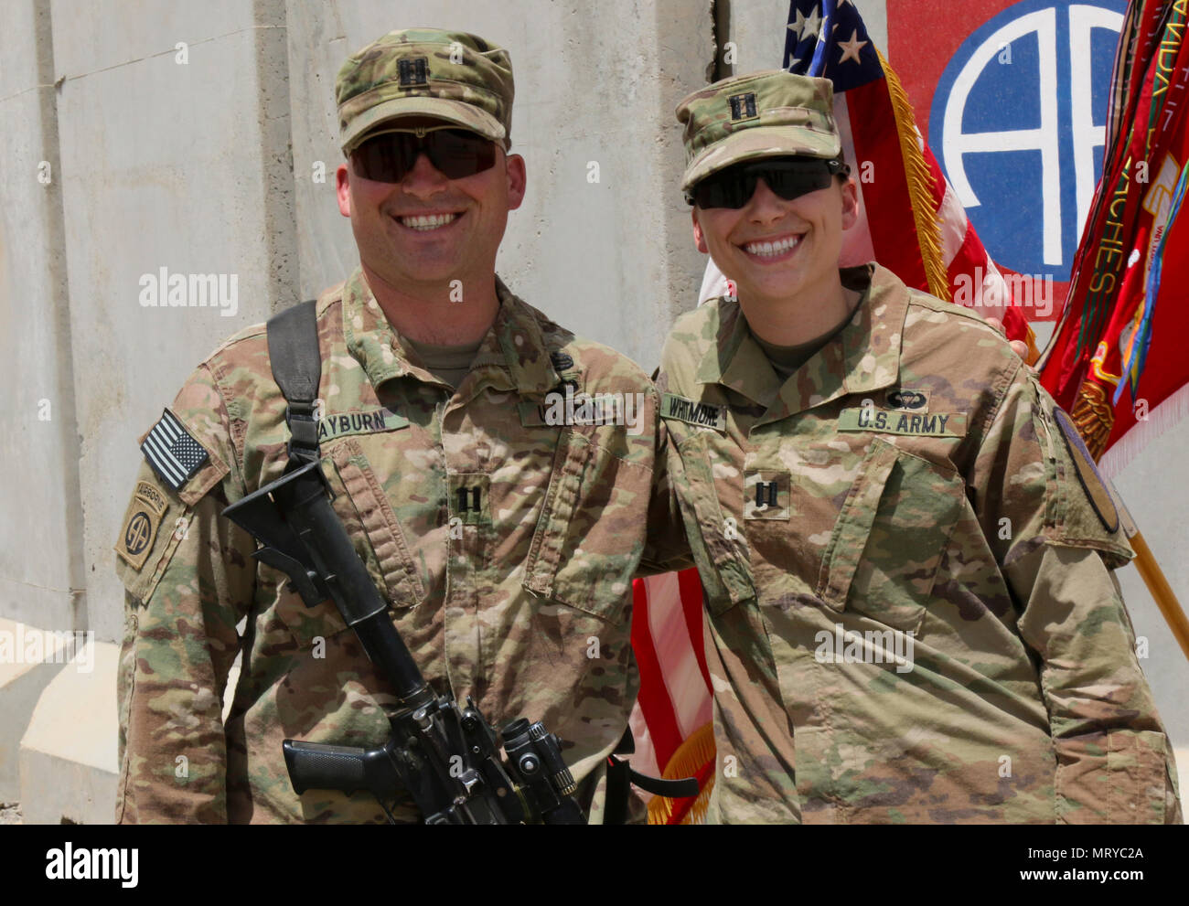 U.S. Army Capt. Kaitlin Whitmore, commander of Charlie Company, 215th Brigade Support Battalion, 3rd Armored Brigade Combat Team, 1st Cavalry Division, and her brother, U.S. Army Capt. Scott Rayburn, incoming commander of Alpha Company, 37th Engineer Battalion, 2nd Brigade Combat Team, 82nd Airborne Division, were able to see each other briefly when she attended his first change-of-command ceremony in Qayyarah West Airfield, Iraq, July 1, 2017. The siblings, who hail from Gainesville, Florida, both attended ROTC in college and were even commissioned during the same week in 2011. (U.S. Army pho Stock Photo