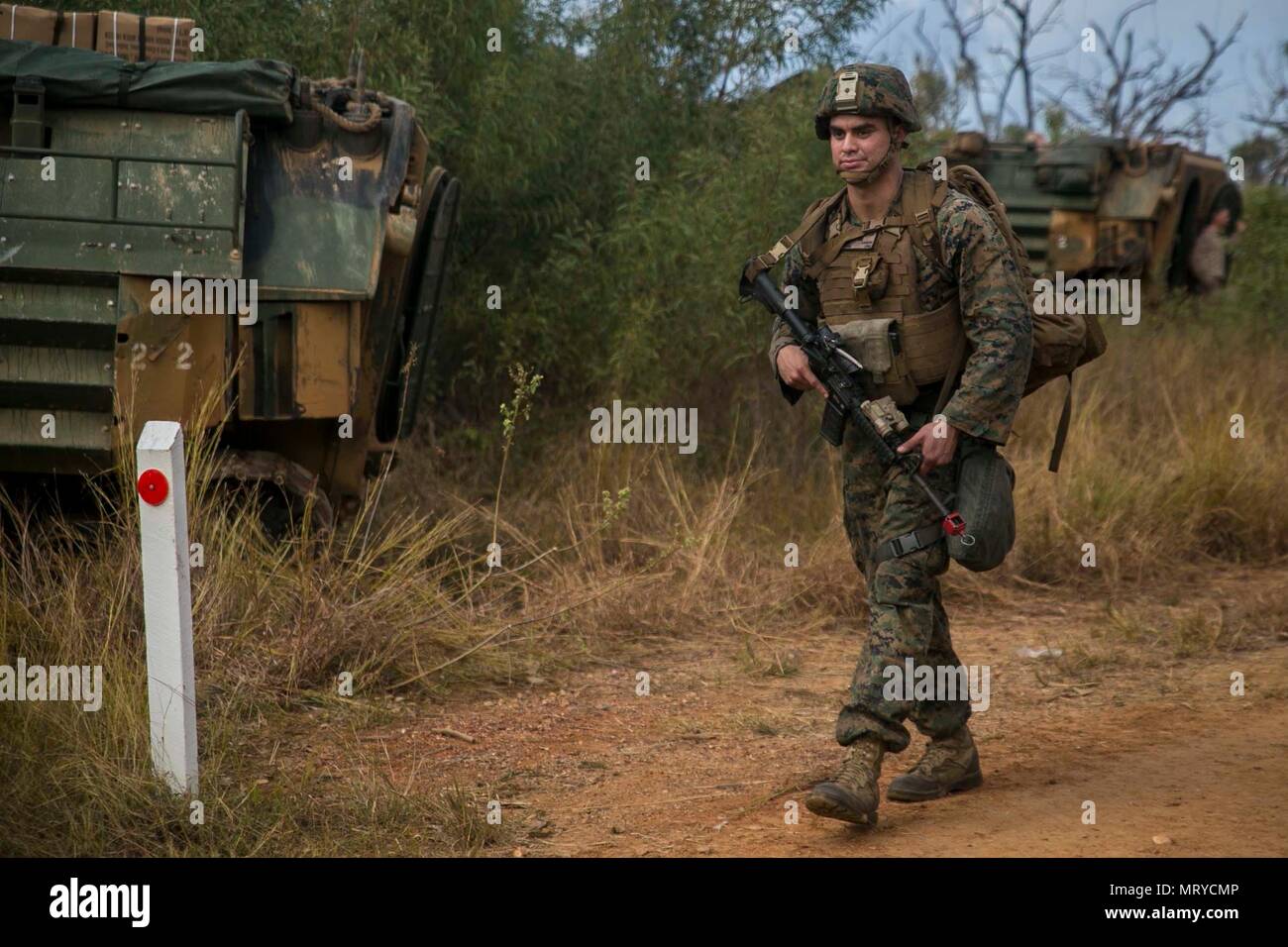 Lance Cpl. Andrew P. Carrera, a mortar man with Weapons Platoon, India Company, Battalion Landing Team, 3rd Battalion, 5th Marines, 31st Marine Expeditionary Unit, patrols through the Australia Defense Force’s Townshend Island Training Area, Queensland, Australia, during Exercise Talisman Saber 17, July 14, 2017. The company’s simulated mission included clearing and securing the training area. India Company is the mechanized raid company for the 31st MEU, currently supporting Talisman Saber 17 while deployed on its scheduled patrol of the Indo-Asia-Pacific region. Talisman Saber is a biennial  Stock Photo