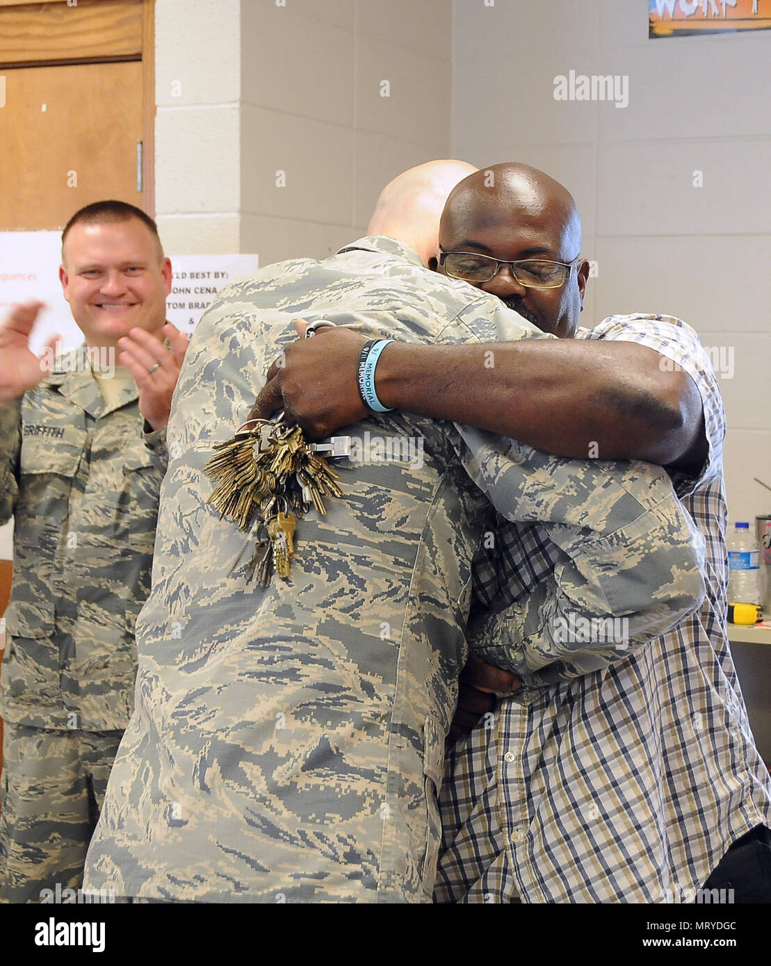 Chief Master Sgt. Ronald C. Anderson, Command Chief Master Sergeant of the Air National Guard, visits Tangipahoa Parish and hugs Mr. Allen Moore Jr., a custodian for the Amite High school on July 15, 2017. The site visit showcased the Louisiana Care Innovative Readiness Training mission here in Eastern Louisiana. The Innovative Readiness Training mission showcases a multi-service and interagency expeditionary readiness training event, which provides medical, dental and optometry care at no cost to the community and surrounding areas. (U.S. Air National Guard photo by Master Sgt. Paula Aragon) Stock Photo