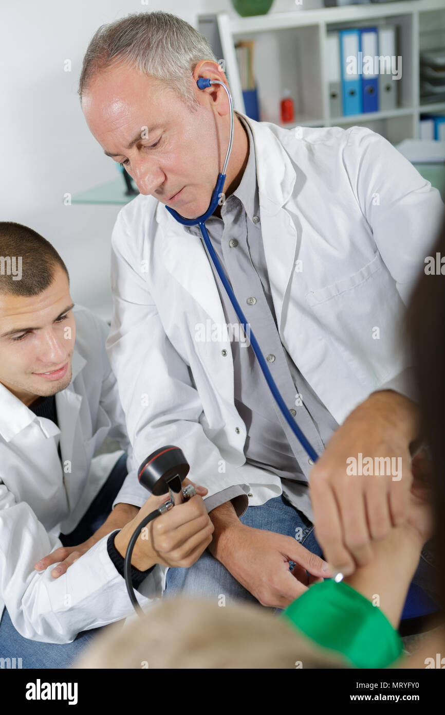 doctor and apprentice learning to pressure measuring Stock Photo - Alamy