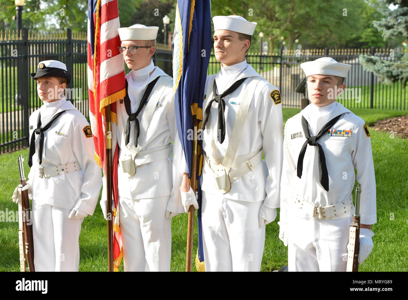 GRAND RAPIDS, Mich. (Jul 14, 2017) - Cadet Seaman Apprentice Alyssia Wealtherly, Battle Creak, Mich., Cadet Seaman Apprentice Austin Merritt, Marshall, Mich., Cadet Seaman Apprentice Martin Dams, Plainwell, Mich., and Cadet Petty Officer 2nd Class, Mich., from the U.S. Naval Sea Cadet Corps, Windward Division present honors at the annual presidential wreath laying ceremony. This day would be the 104th birthday of President Gerald R. Ford. The ceremony was held today at Ford's gravesite at the presidential museum. (U.S. Navy photo by Mass Communication Specialist 1st Class Jenny L. Lasko) Stock Photo