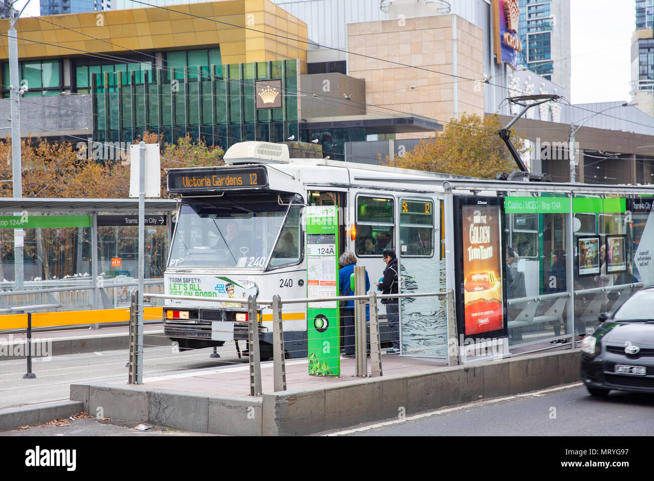 Melbourne tram at a tram stop in melbourne city centre,Victoria,Australia Stock Photo