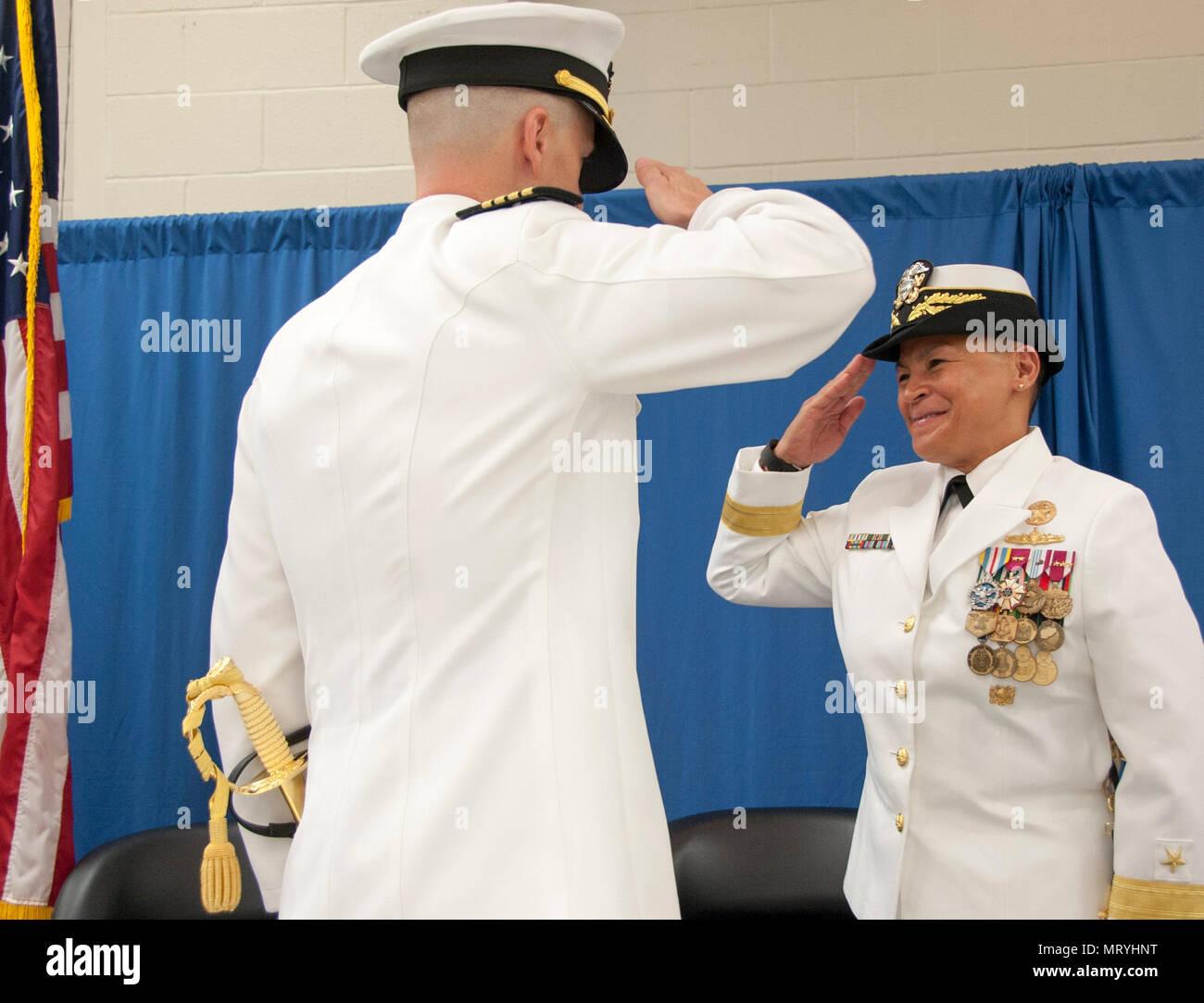 170714-N-AP176-092 MILLINGTON, Tenn.  (July 14, 2017) Capt. David Bryson, outgoing commanding officer, Naval Support Activity Mid-South, reports to Rear Adm. Bette Bolivar, commander, Navy Region Southeast, as he relinquishes command of NSA Mid-South. (U.S. Navy photo by Mass Communication Specialist 1st Class Jeff Atherton/released) Stock Photo