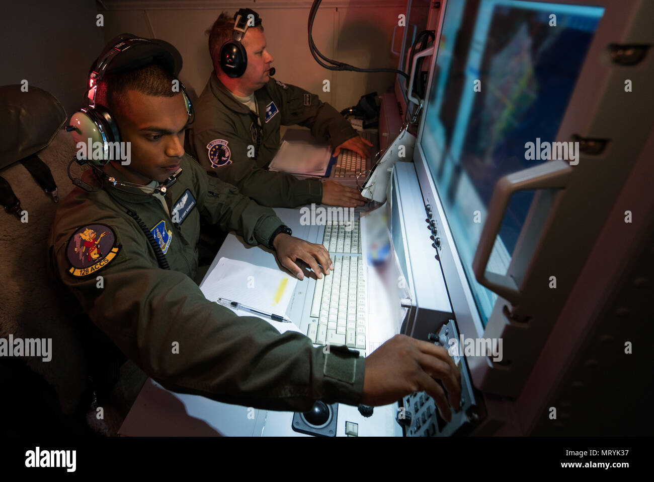 u-s-air-force-airman-1st-class-samir-manohar-left-and-tech-sgt-louis-smith-airborne-operations-technicians-with-the-116th-air-control-wing-acw-georgia-air-national-guard-track-surveillance-data-from