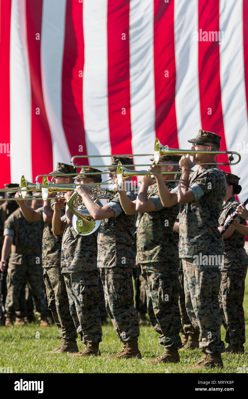 U.S. Marines assigned to II Marine Division Band perform during the II Marine Expeditionary Force (II MEF) change of command ceremony on Camp Lejeune, N.C., July 14, 2017. During the ceremony, Maj. Gen. Walter L. Miller Jr. relinquished his command as commanding general of II MEF to Lt. Gen. Robert F. Hedelund. (U.S. Marine Corps photo by Lance Cpl. Koby I. Saunders) Stock Photo