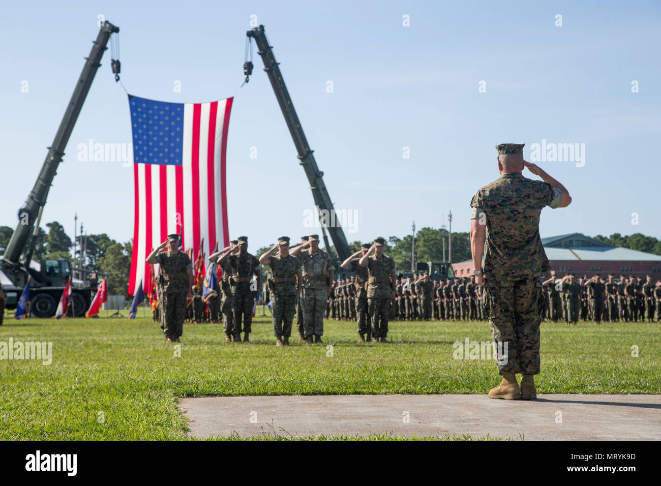 U.S. Marine Corps Lt. Gen. Robert F. Hedelund, commanding general of the II Marine Expeditionary Force (MEF) salutes Marines during a change of command ceremony on Camp Lejeune, N.C., July 14, 2017. During the ceremony, Maj. Gen. Walter L. Miller Jr. relinquished his command as commanding general of II MEF to Hedelund. (U.S. Marine Corps photo by Lance Cpl. Koby I. Saunders) Stock Photo