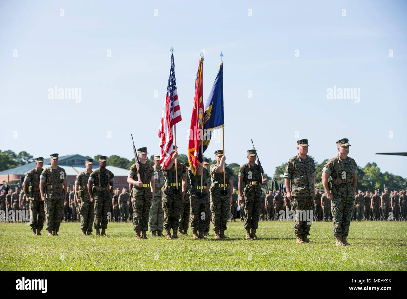 U.S. Marines assigned to II Marine Expeditionary Force (MEF) stand at attention during a change of command ceremony on Camp Lejeune, N.C., July 14, 2017. During the ceremony, Maj. Gen. Walter L. Miller Jr. relinquished his command as commanding general of II MEF to Lt. Gen. Robert F. Hedelund. (U.S. Marine Corps photo by Lance Cpl. Koby I. Saunders) Stock Photo