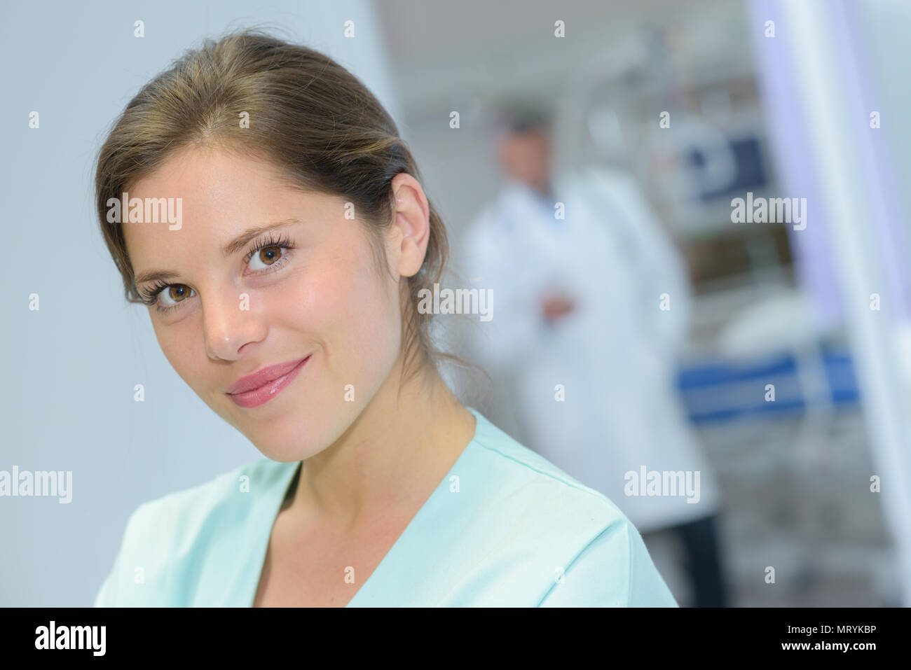 portrait of female nurse standing in hospital corridor Stock Photo - Alamy