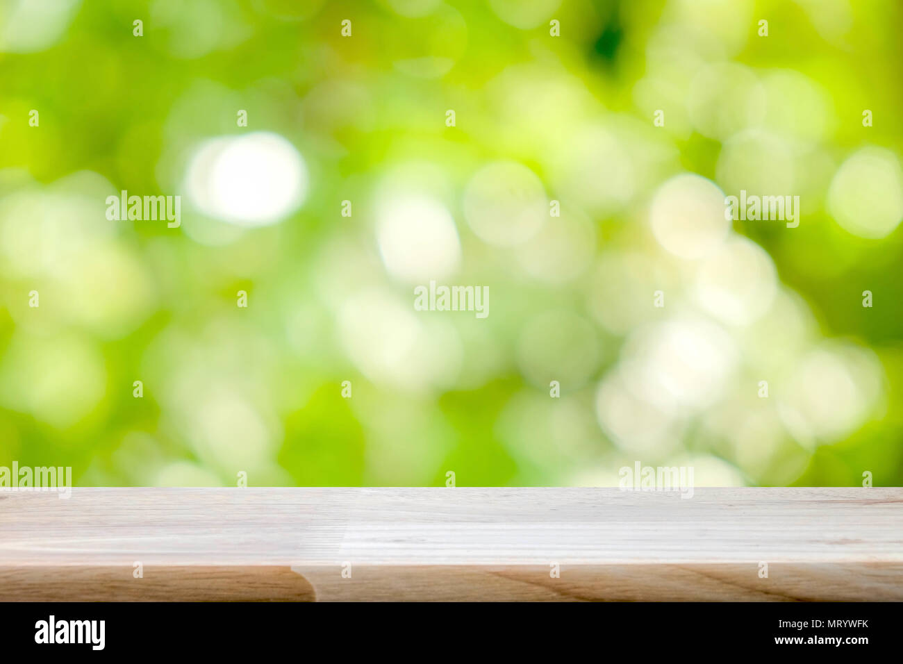 Wood table top on blur green bokeh background Stock Photo - Alamy
