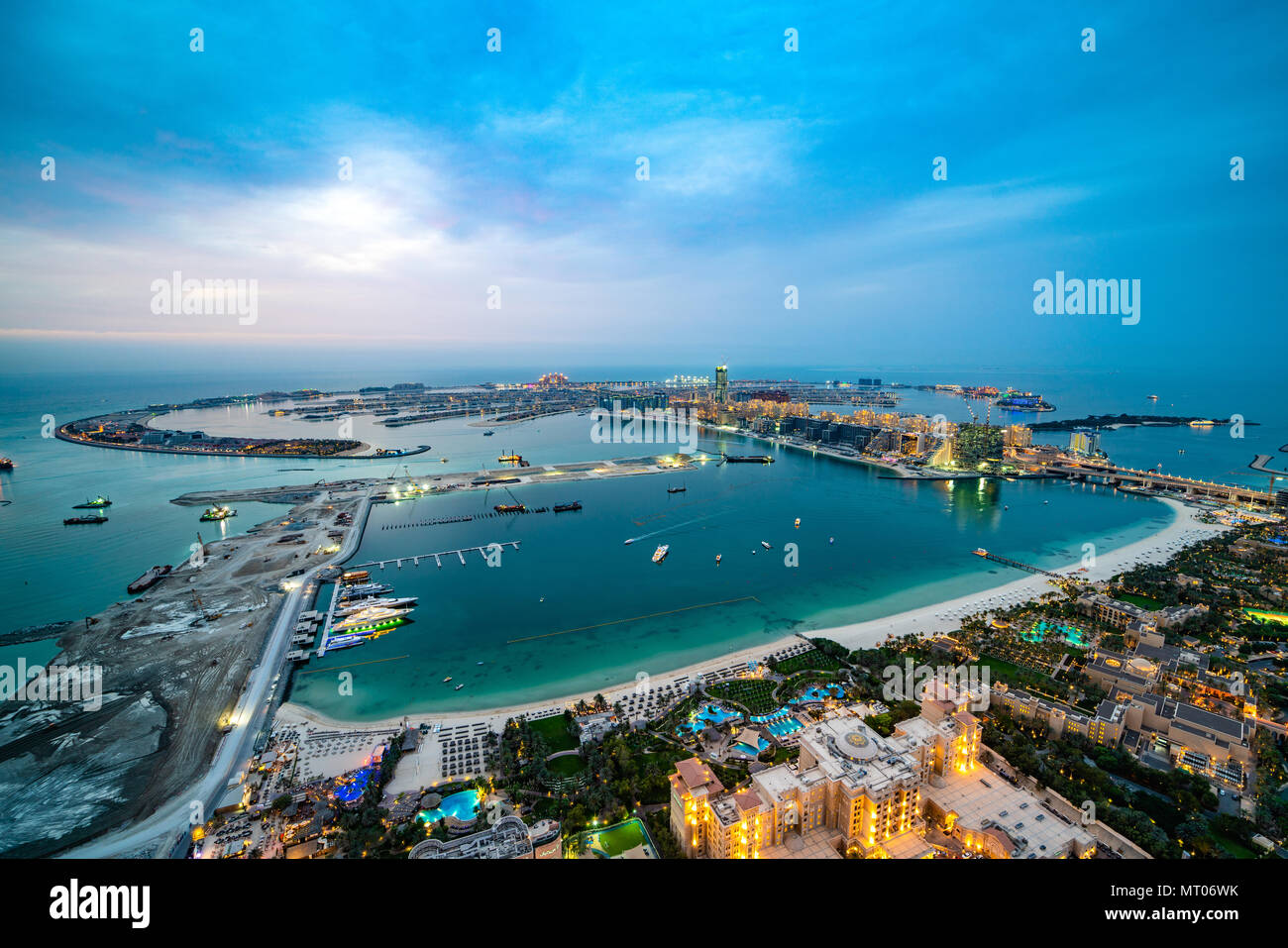 Aerial photo of the Palm Jumeirah in Dubai at cloudy sunset Stock Photo