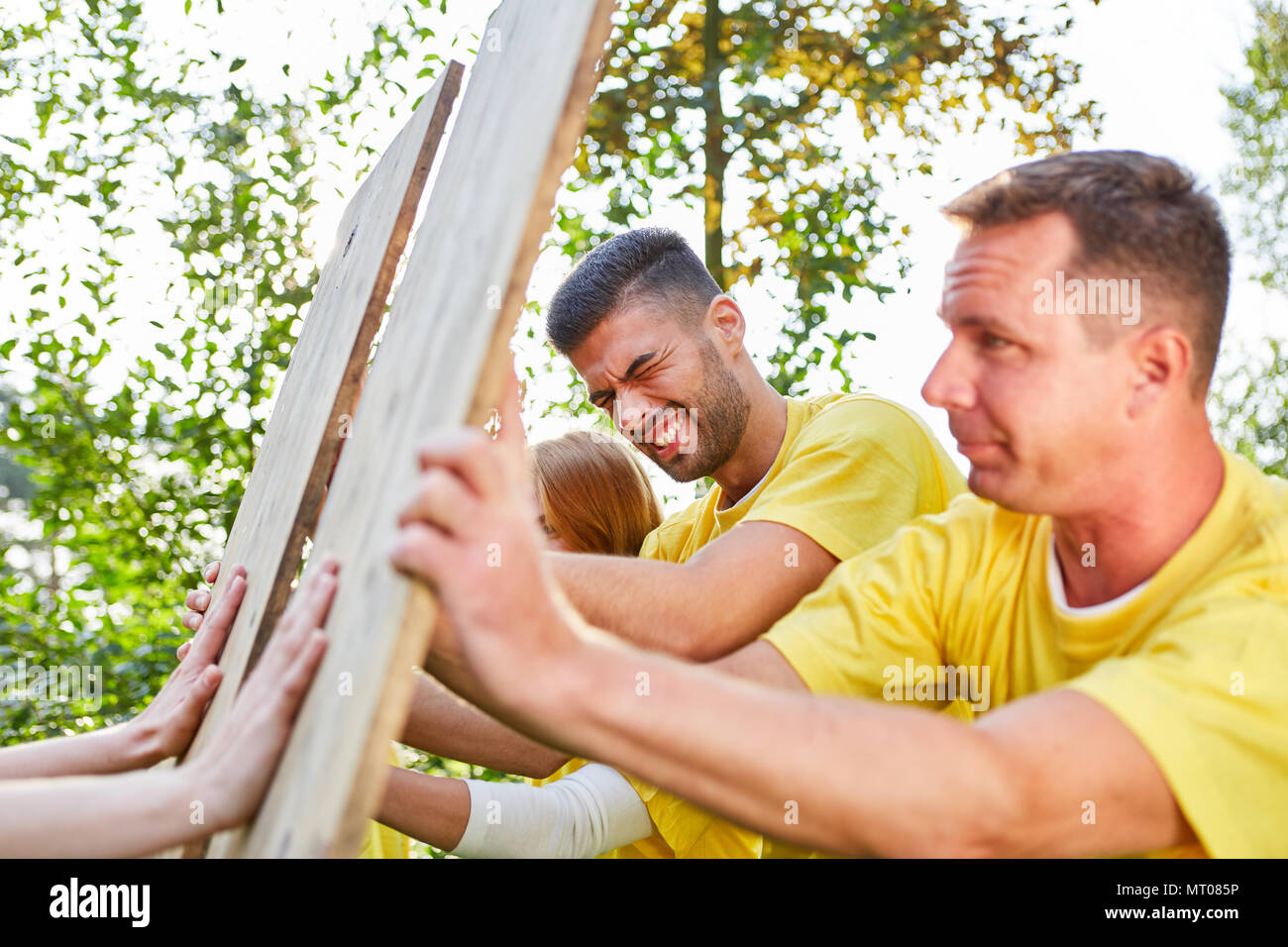 Young team trains confrontation and strength in a teamwork workshop Stock Photo