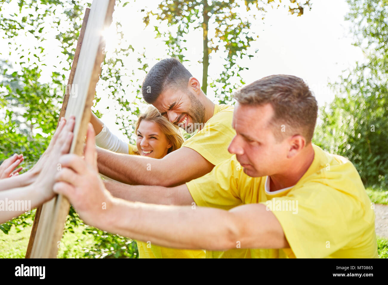 Sporting team in a competition trains strength and cohesion Stock Photo ...