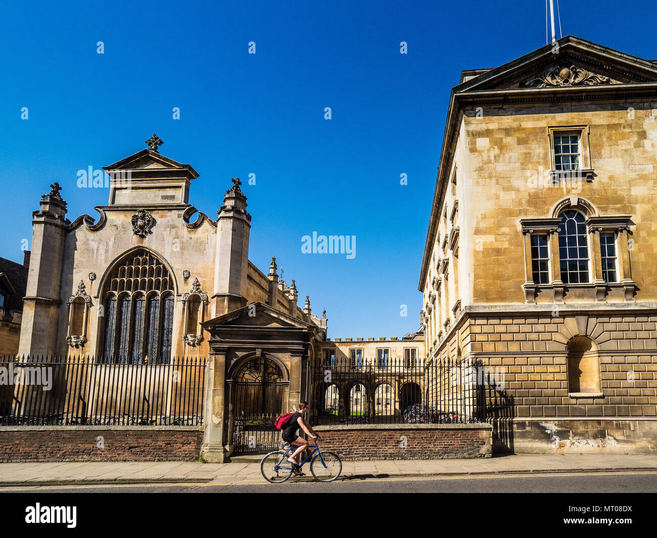 Peterhouse College, Cambridge University, Trumpington Road. Cyclists pass the college entrance and chapel. Peterhouse was founded in 1284. Stock Photo