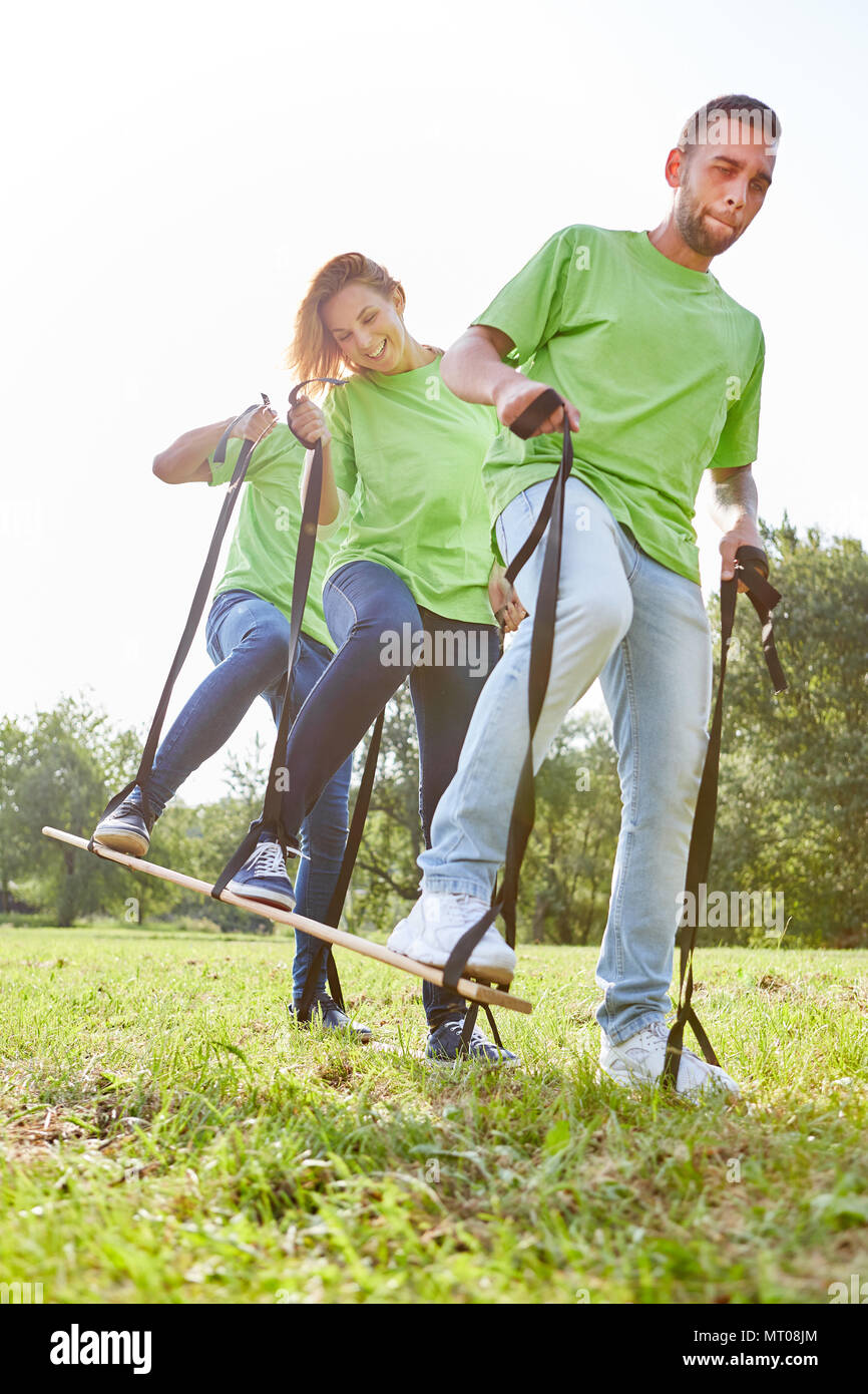 Young people are exercising coordination and teamwork in a teambuilding exercise Stock Photo