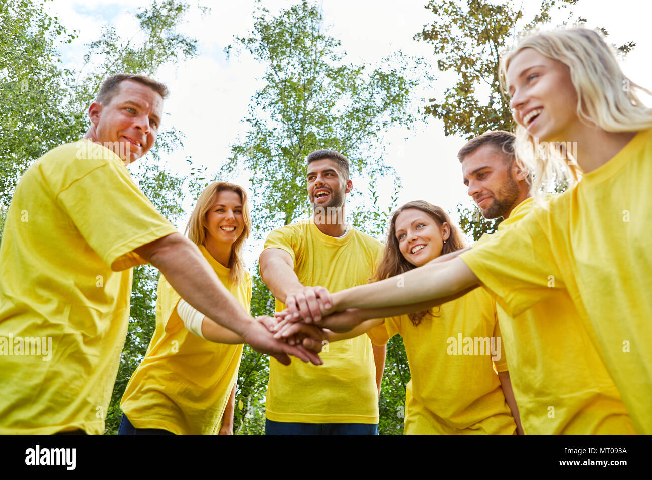 Start-Up Team does an exercise to strengthen team spirit and team development Stock Photo