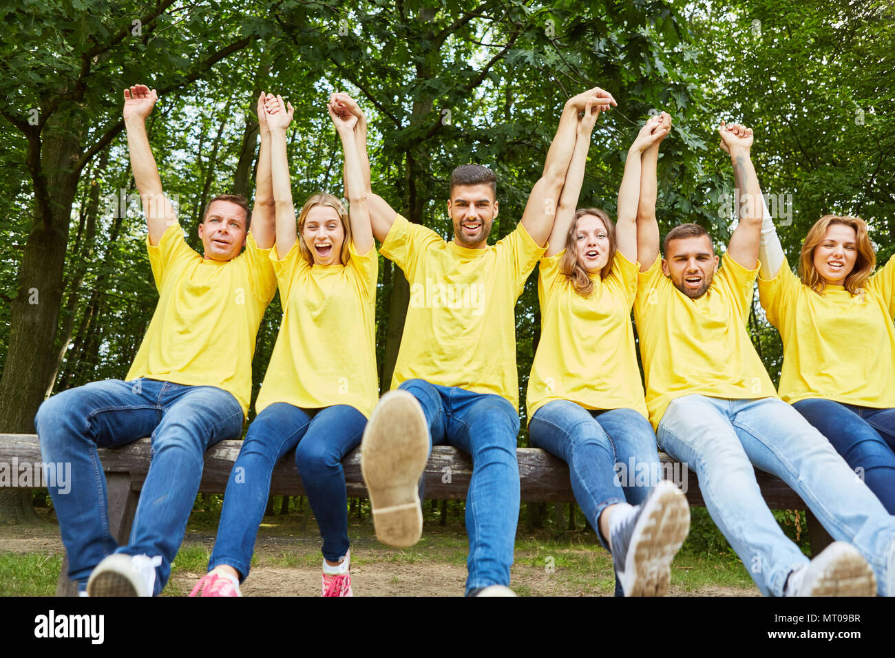 Young people as a successful team holds hands for team spirit Stock Photo