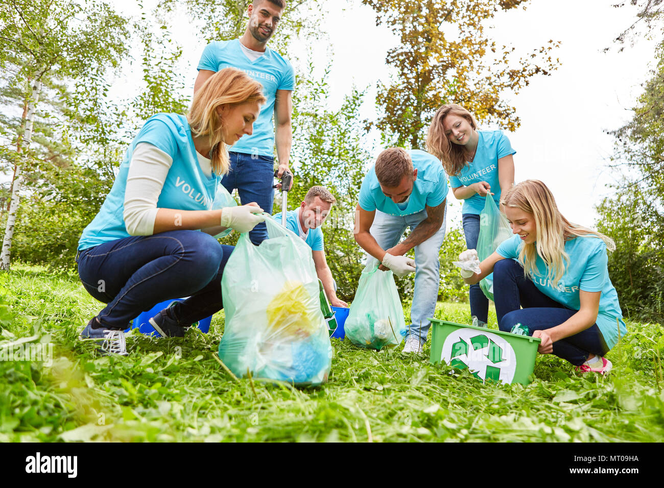 Young people volunteer as garbage collectors at an environmental action