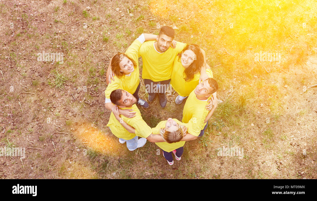 Joint hug in team as teambuilding concept Stock Photo - Alamy
