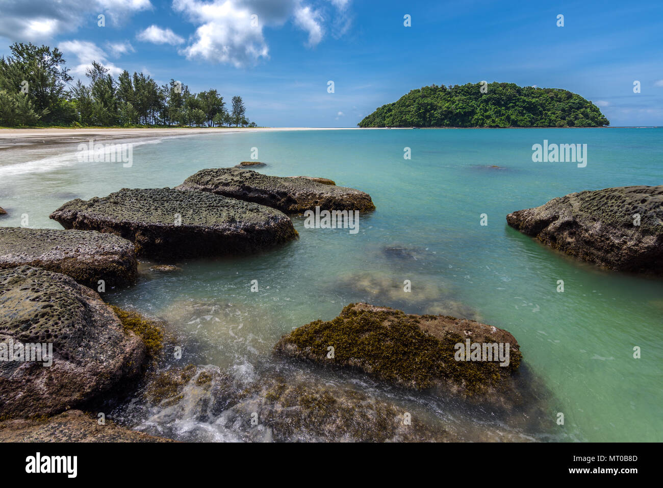 A beautiful setting of a small island with a walkable sand band in the region of the Tip of Borneo, Malaysia. Stock Photo