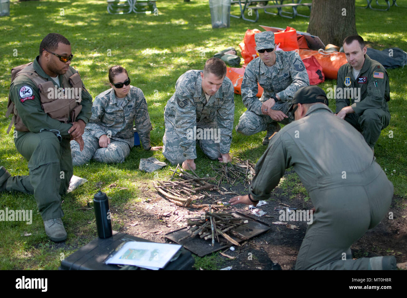 Airmen with the 128th Air Refueling Wing gather around an aircrew ...