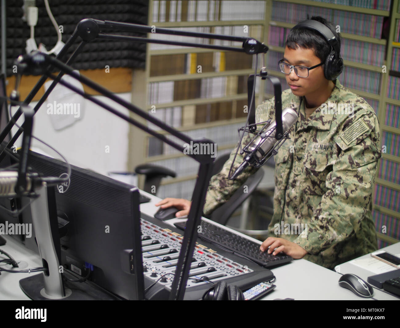 170717-N-DJ347-006 - DIEGO GARCIA, British Indian Ocean Territory (July 17,  2017) Mass Communication Specialist 3rd Class Jimmy Ong prepares for the  afternoon radio show on FM 99.1 The Eagle at American Forces