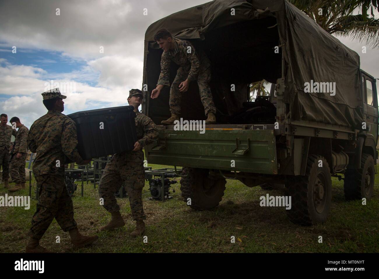 U.S. Marines with Task Force Koa Moana 17 load parts of a Light Weight Water Purification System onto a supply truck during Exercise TAFAKULA on Tongatapu Island, Tonga, July 17, 2017. Exercise TAFAKULA is designed to strengthen the military-to-military relations, infantry and combat training between Tonga’s His Majesty’s Armed Forces, French Army of New Caledonia, New Zealand Defense Force, and the United States Armed Forces.  (U.S. Marine Corps photo by MCIPAC Combat Camera Lance Cpl. Juan C. Bustos) Stock Photo