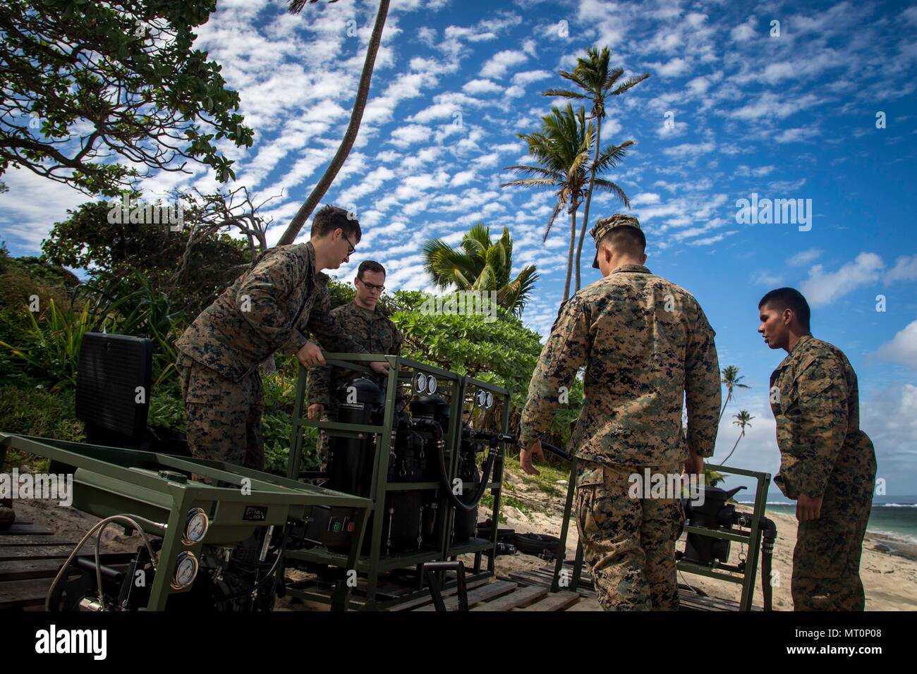 U.S. Marines with Task Force Koa Moana 17 set up a Light Weight Water Purification System on a beach on Tongatapu Island, Tonga during Exercise TAFAKULA July 17, 2017. Exercise TAFAKULA is designed to strengthen the military-to-military relations, infantry and combat training between Tonga’s His Majesty’s Armed Forces, French Army of New Caledonia, New Zealand Defense Force, and the United States Armed Forces.  (U.S. Marine Corps photo by MCIPAC Combat Camera Lance Cpl. Juan C. Bustos) Stock Photo
