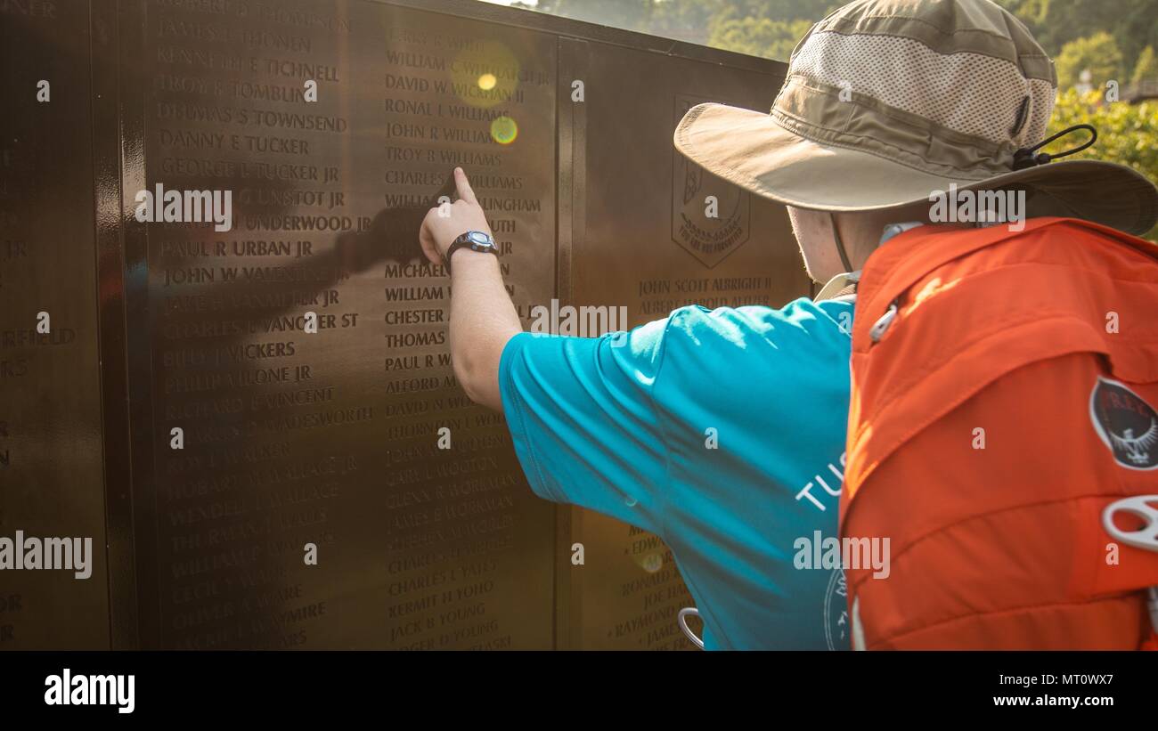 A scout takes a moment to read the names of those who made the ultimate sacrifice during the Vietnam War at the military exhibition at the 2017 National Jamboree held on Summit Bechtel Reserve near Glen Jean, W.Va., July 20, 2017. The 2017 National Jamboree is being attended by 30,000 Boy Scouts, troop leaders, volunteers and professional staff members, as well as more than 15,000 visitors. Approximately 1,200 military members from the Department of Defense and the U.S. Coast Guard are providing logistical support for the event. (U.S. Army photo by Spc. Dustin D. Biven/22nd Mobile Public Affai Stock Photo