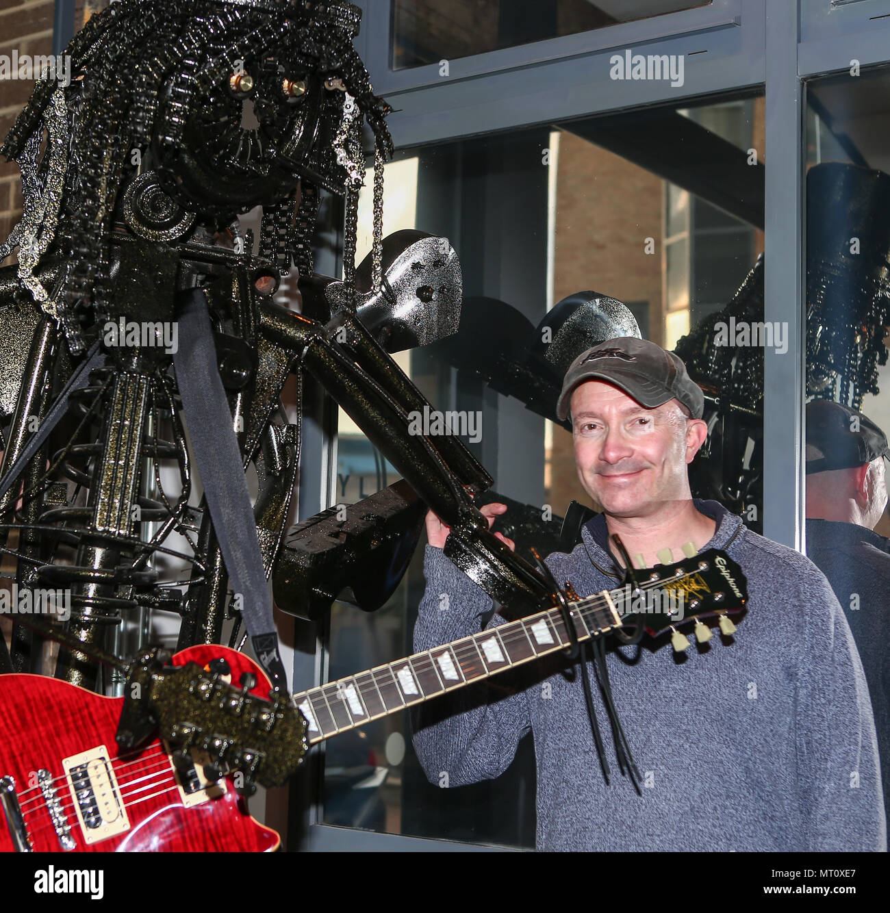 PICTURE SHOWS: Artist Simon Weitzman.  ....  A unique sculpture of rock musician Slash is going under the hammer.  The larger-than-life, 7.5 feet tall work has been painstakingly fashioned from recycled car, bike and instrument parts.  Officially signed by Slash in two places, it is the work of artist Simon Weitzman and welder/finisher Darren Kenny, of Heavy Metal Sculptures (https://www.heavymetalsculptures.com/)  It was made to benefit IFAW, the International Fund for Animal Welfare, of which Slash acts as an ambassador, and comes fitted with a Slash signature guitar.  The piece has a starti Stock Photo