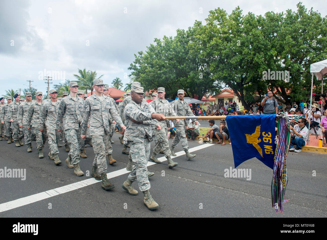 U.S. Airmen from the 36th Wing march in the 73rd Guam Liberation Day parade July 21, 2017, in Hagåtña, Guam. The parade commemorated 73 years since U.S. armed forces liberated the island from Japanese occupation. During World War II, Japan seized Guam on December 10, 1941, and on July 21, 1944, the U.S. armed forces liberated the island. (U.S. Air Force photo by Airman 1st Class Christopher Quail) Stock Photo