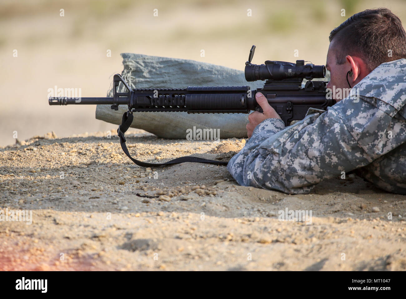 A U.S. Army Soldier fires an M16A4 rifle during the Squad Designated ...