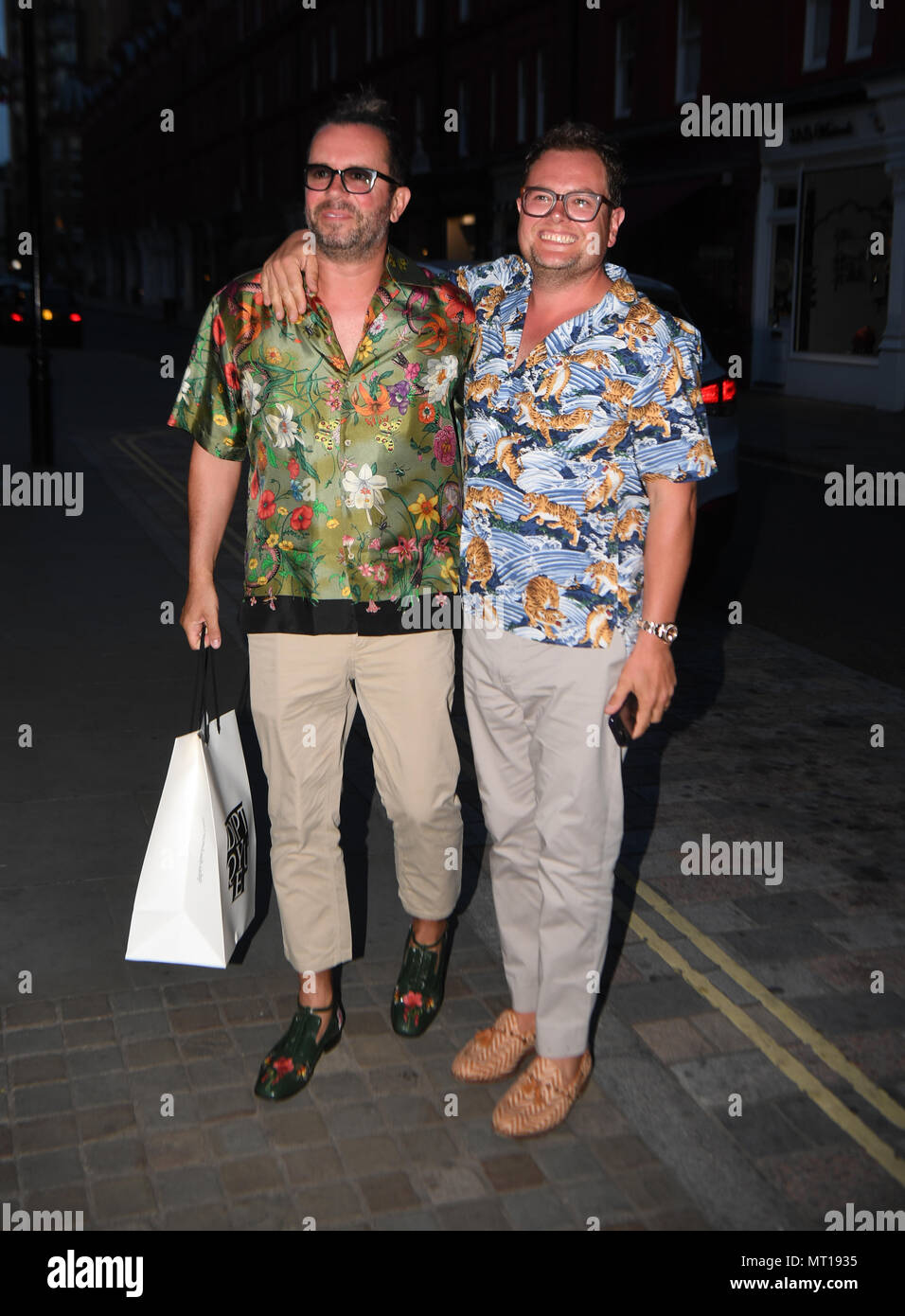 Alan Carr and partner Paul Drayton (left) arriving at Chiltern