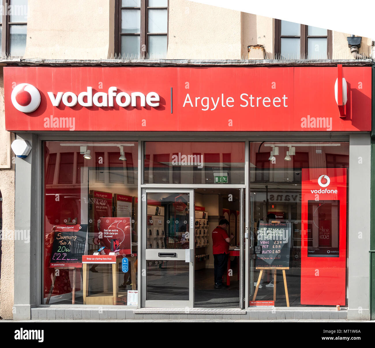 Frontage and open entrance of the Vodaphone mobile phone retail shop in